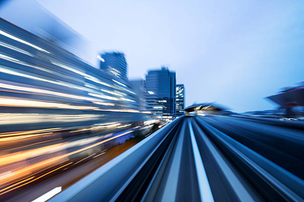 istock motion blur of train moving through city in tokyo 540846540