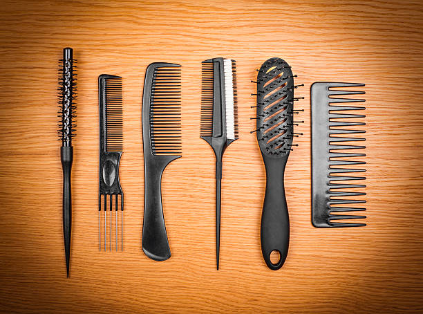 istock hairbrushes on a wooden background 540846870