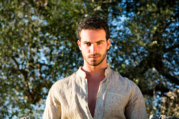 istock Man Relaxing in Warm Sunlight among Trees 540851614