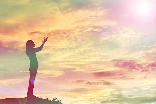 istock silhouette of a young woman standing alone 540851634