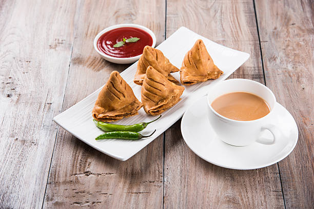 istock Samosa snack with tomato ketchup and hot tea 540852400