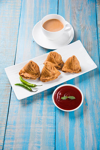 istock Samosa snack with tomato ketchup and hot tea 540853242