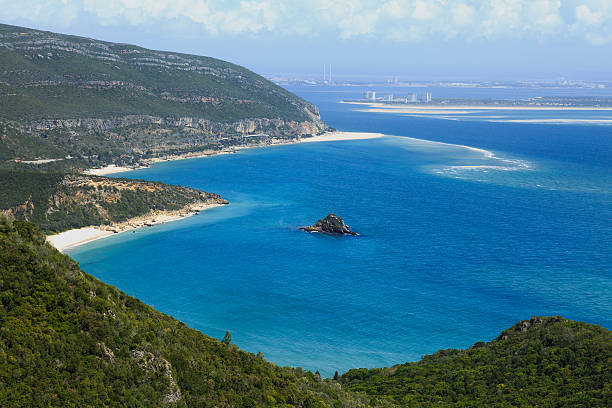 viewing the peninsula of Troia Road leading north from the city of Setubal in Portugal. Peninsual of Troia far to the horizon on the right side troia stock pictures, royalty-free photos & images