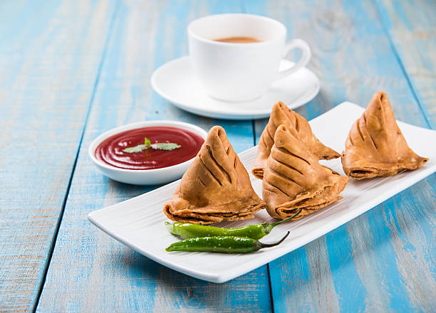 istock Samosa snack with tomato ketchup and hot tea 540853902