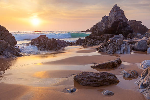 istock Fantastic big rocks and ocean waves at golden sundown 540854054