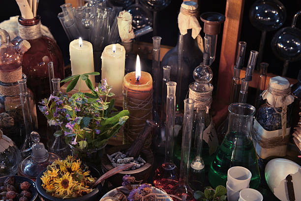 istock Homeopathic still life with bottles, flasks, old candle and herbs 540854286