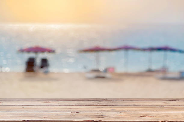 istock Wood floor on blurred sand beach background. 540854768