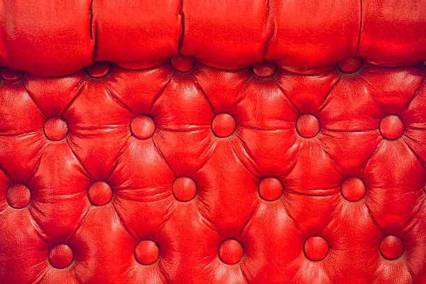 istock Texture of vintage red leather upholstery with buttons 540855954
