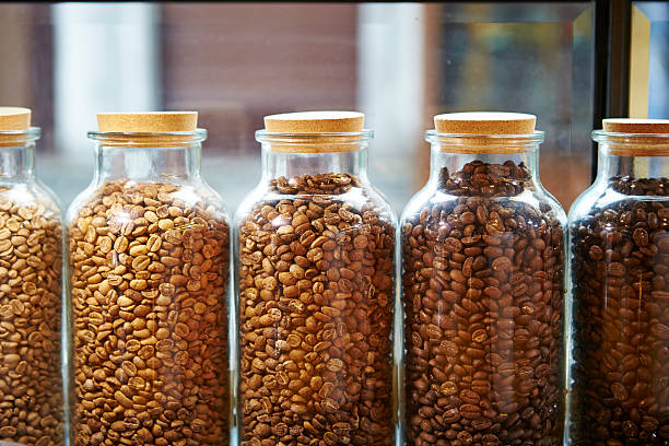 Coffee beans in bottle stock photo