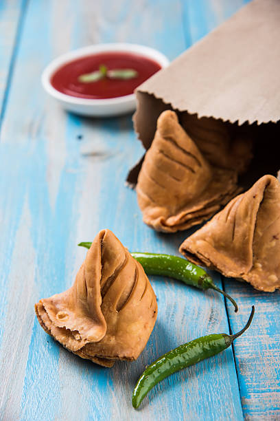 istock Samosa snack with tomato ketchup and hot tea 540856972