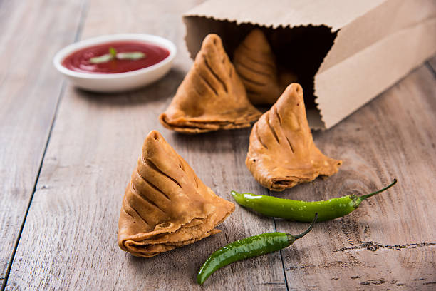 istock Samosa snack with tomato ketchup and hot tea 540857788