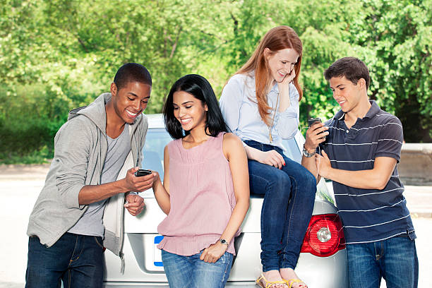 istock Teenagers with car 540858346