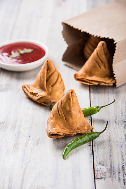 istock Samosa snack with tomato ketchup and hot tea 540858876