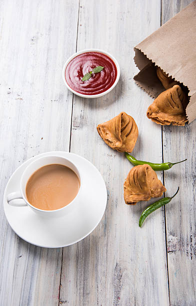 istock Samosa snack with tomato ketchup and hot tea 540859282