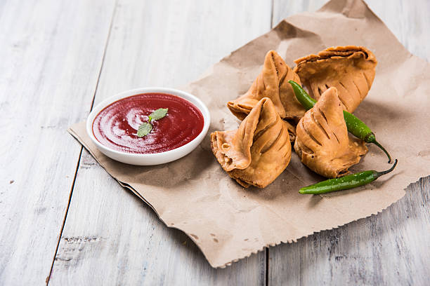 istock Samosa snack with tomato ketchup and hot tea 540859456