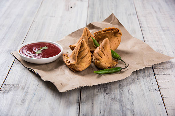 istock Samosa snack with tomato ketchup and hot tea 540859648