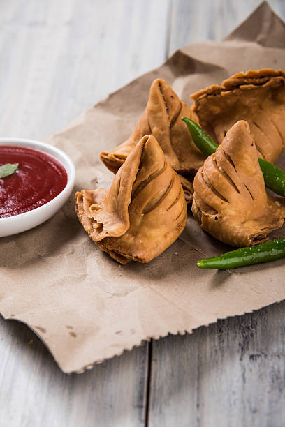 istock Samosa snack with tomato ketchup and hot tea 540860180