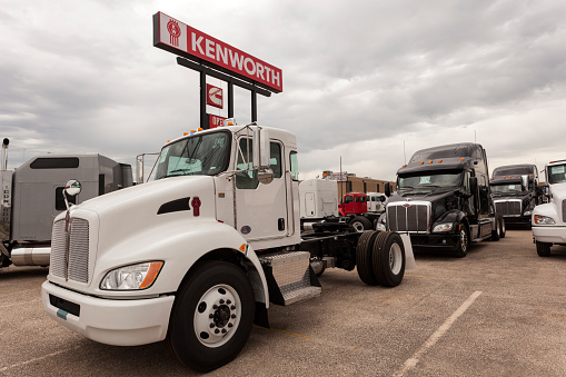 Dallas, Tx, USA - April 9, 2016: New Kenworth T270 flatbed truck chassis at the dealership. Dallas, Texas, United States