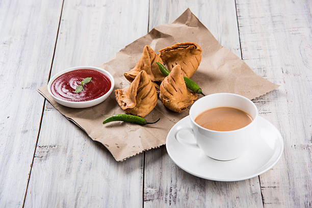 Samosa snack with tomato ketchup and hot tea