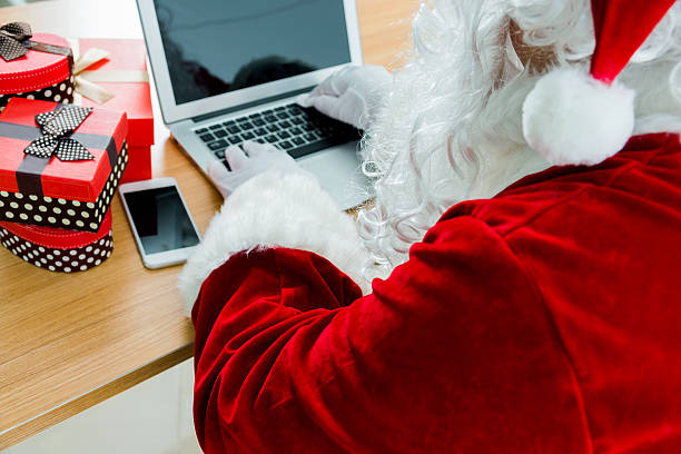 istock Santa claus working on laptop 540861240