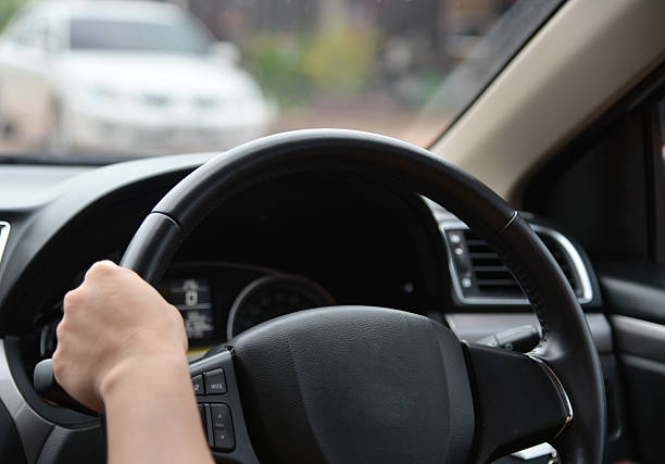 istock blurred hand driving on the street 540864598
