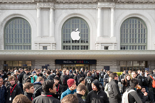 Apple Worldwide Developers Conference 2016 San Francisco - Jun 13th, 2016: People queuing for the Apple Worldwide Developers Conference at the historic Bill Graham Civic Auditorium. costantino stock pictures, royalty-free photos & images