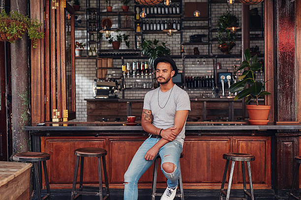 istock Upset young man sitting alone at a cafe counter 540866186