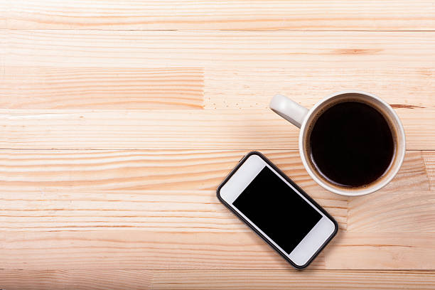 istock Black coffee laptop notebook business generic phone natural wooden light 540866410