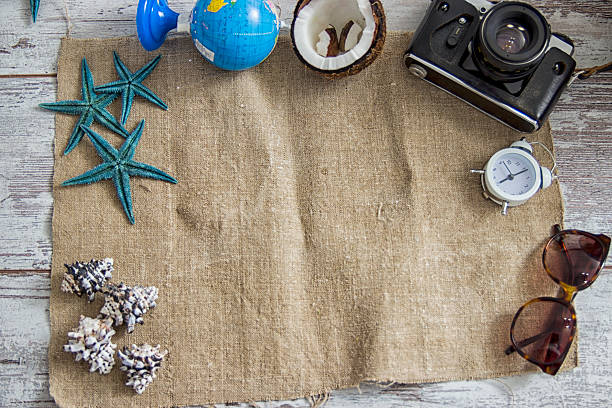 istock Travel and vacation items on wooden table. 540867504