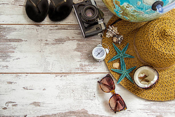 istock travel items on wooden background 540867726