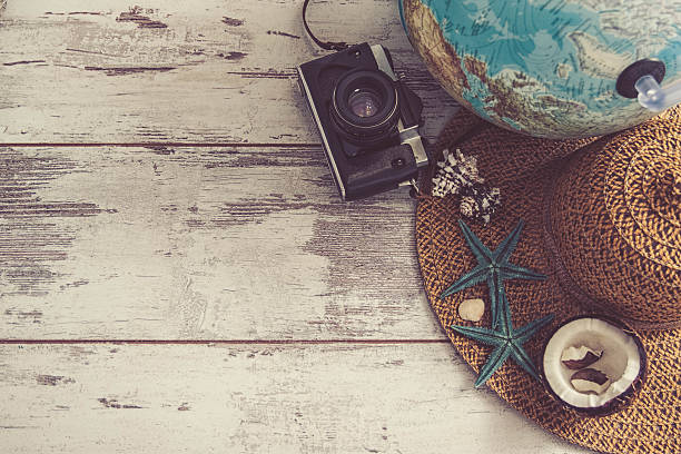 istock travel items on wooden background 540867788