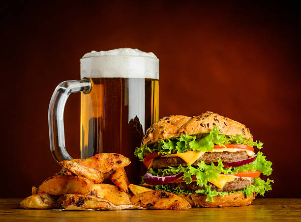 istock Cold Beer with Burger and Fried Potatoes 540868032