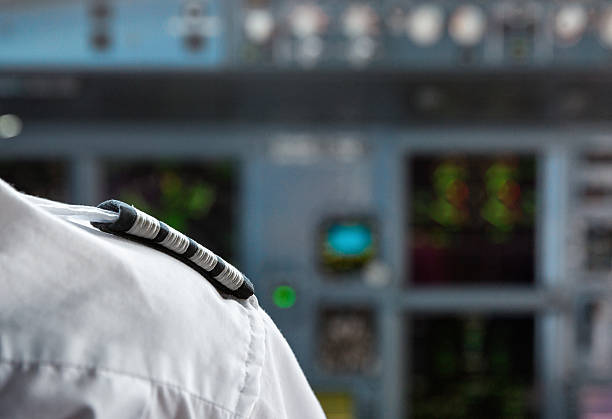 Senior Pilot looking back from cockpit to passenger compartment
