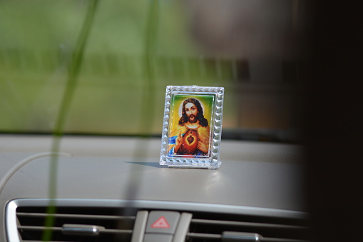 Goa, India - October 22, 2015 - Picture of Jesus in indian taxi