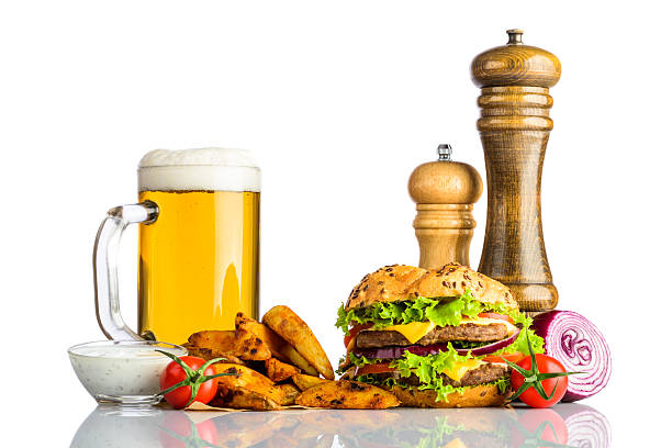 istock Mug Cold Beer with Fries and Burger on White Background 540868996