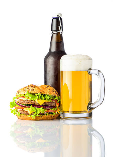istock Burger with Bottle and Mug of Cold Beer on White 540869636