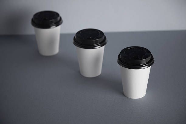 istock White paper cups isolated on gray mockup set 540869840