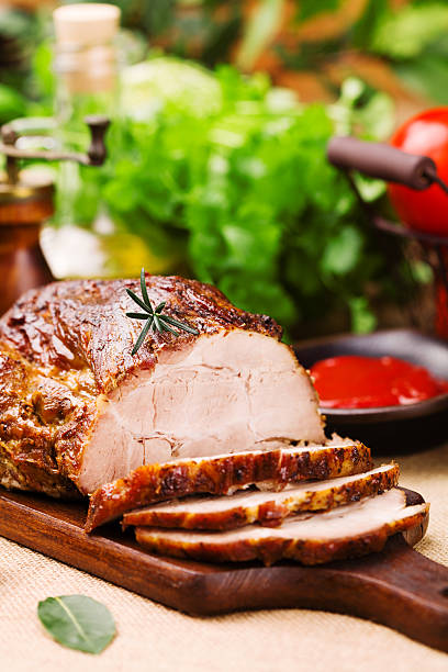 istock Roast pork with tomato dip and herbs. 540871966
