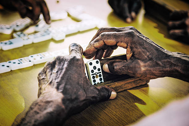 Hands of domino players in Santiago de Cuba, Cuba.