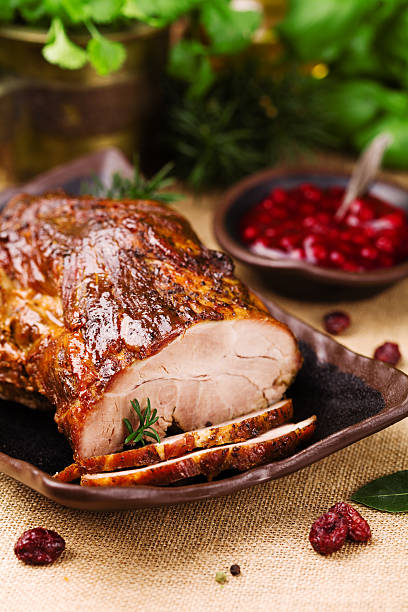 istock Roast pork with cranberry dip, basil, coriander and rosemary. 540872080