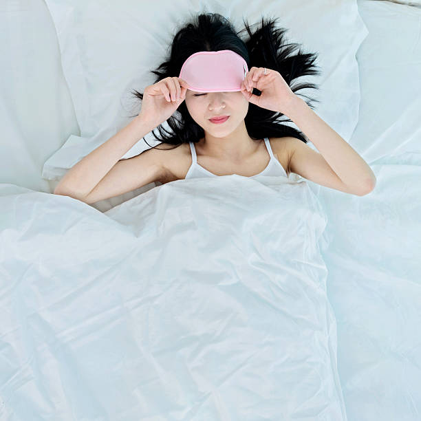 istock woman sleeping in sleep mask 540960824
