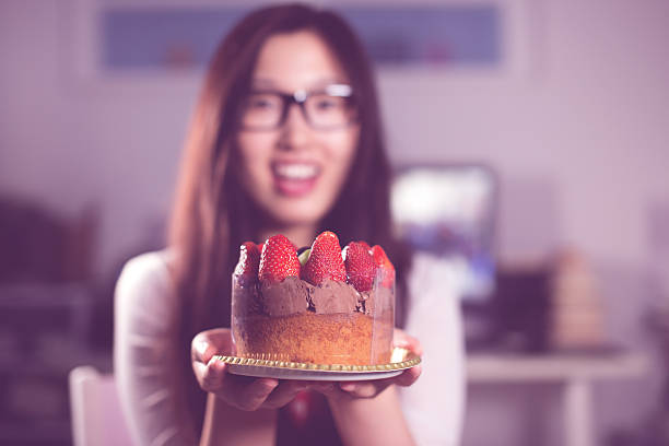Woman holding a cake