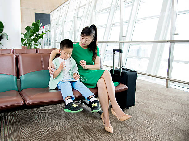 istock Mother and son at airport 540962342