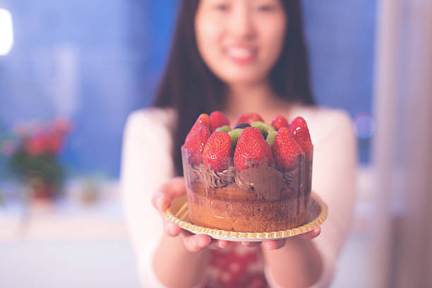 istock Woman holding a cake 540962662