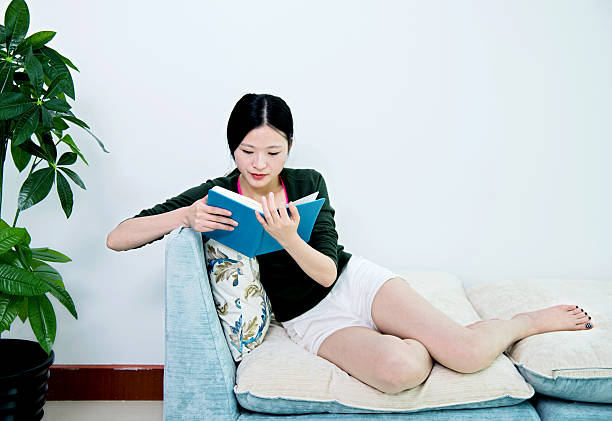 istock Reading book in living room 540966134