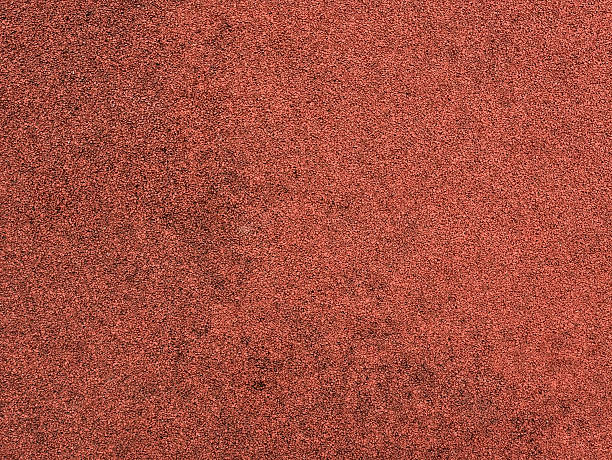 istock Red protective rubber coating for sports and children playgrounds. Texture 540966282