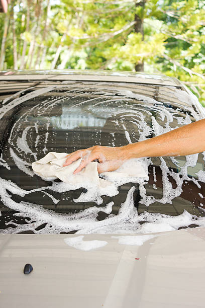 istock Man washing car at home. 540966526