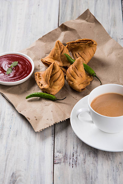 istock Samosa snack with tomato ketchup and hot tea 540967076