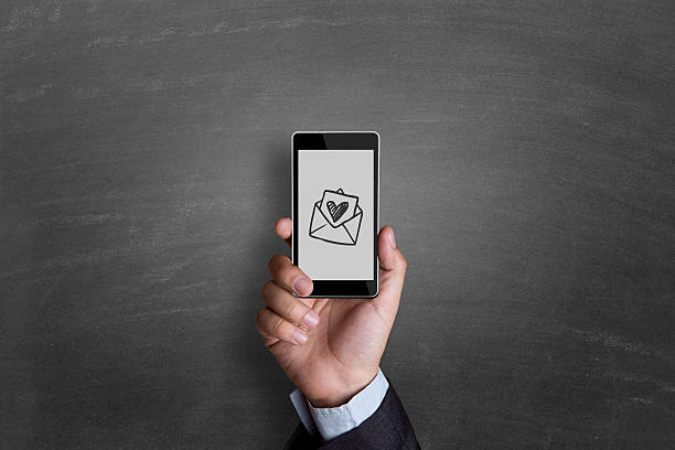istock businessman hand showing heart shaped envelop 540967114