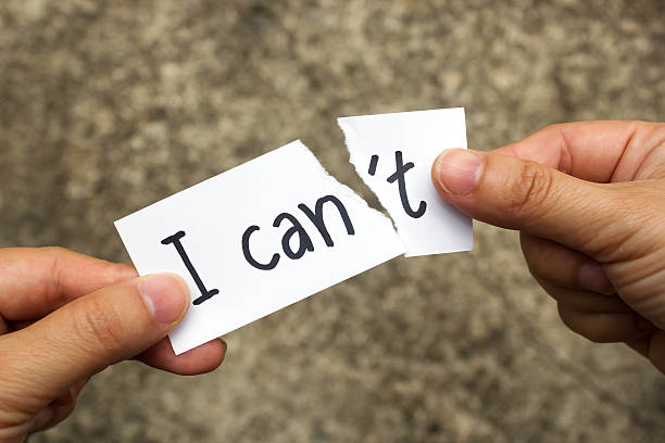 istock Woman' hand holding a card with text can't. 540967612